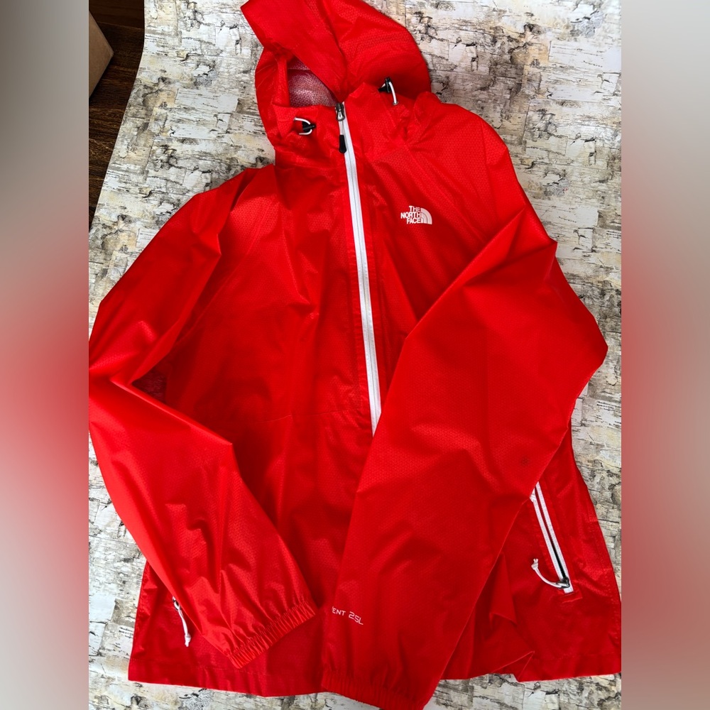 Women’s orange The North Face raincoat